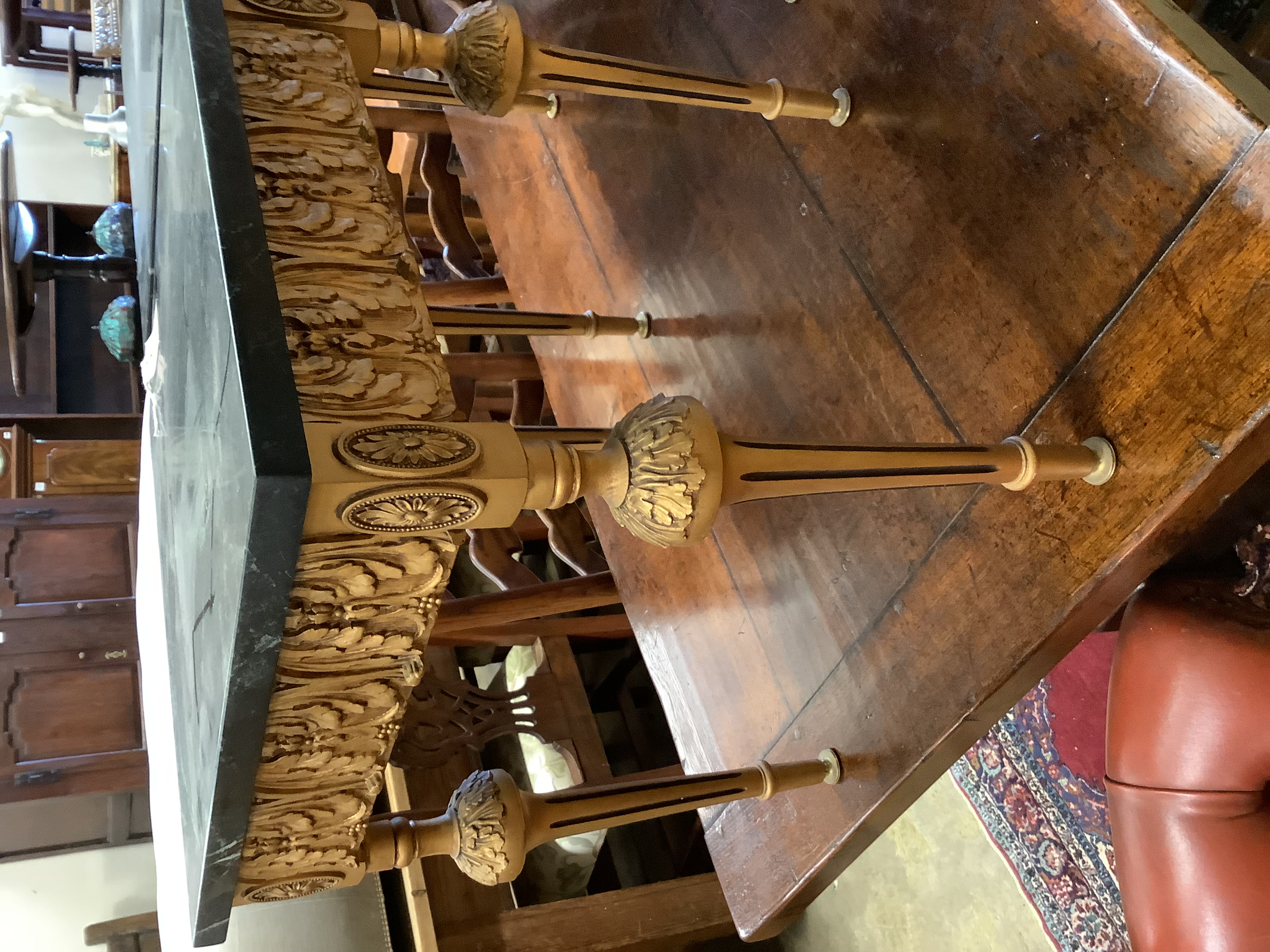 A pair of square giltwood side tables with variegated black marble tops, width 45cm, height 49cm